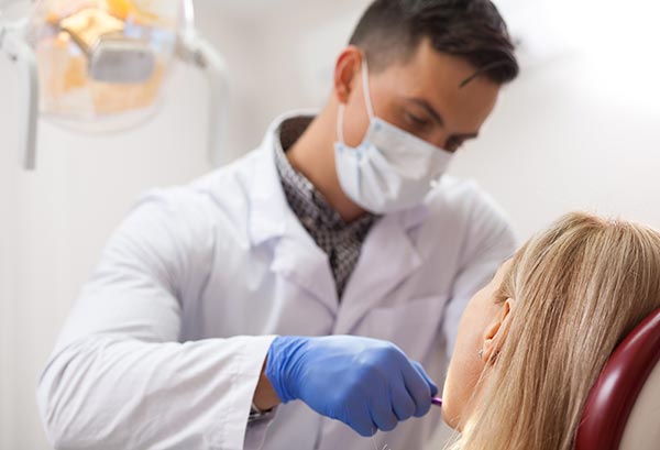 image of a dentist providing emergency care